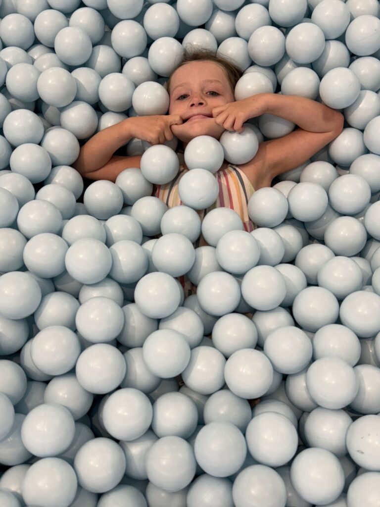 Mercy in ball pit at color factory